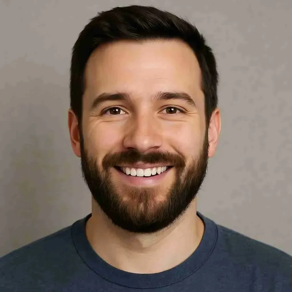 A profile photo of a Smiling Bearded Man